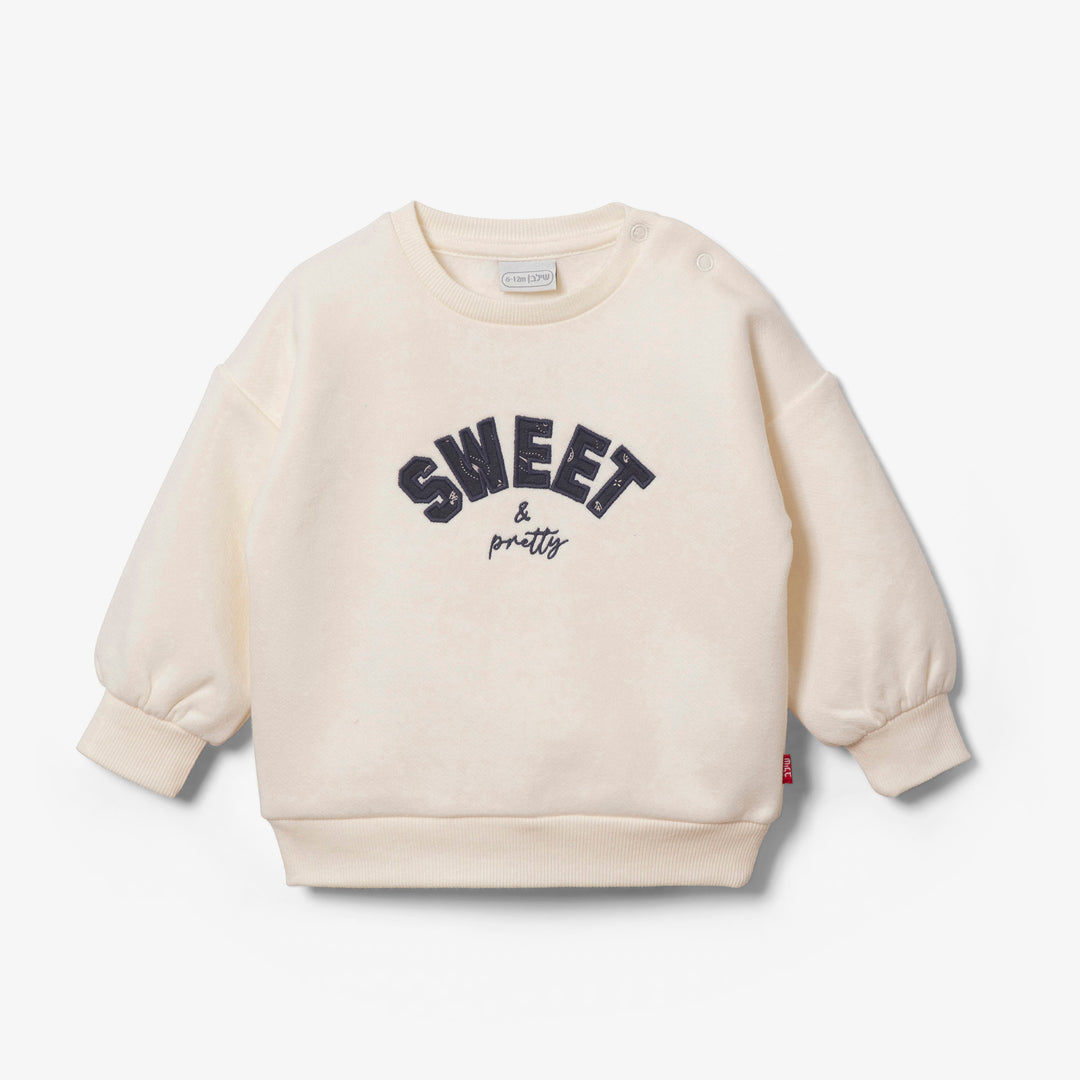 סוויטשירט שמנת עם הדפס